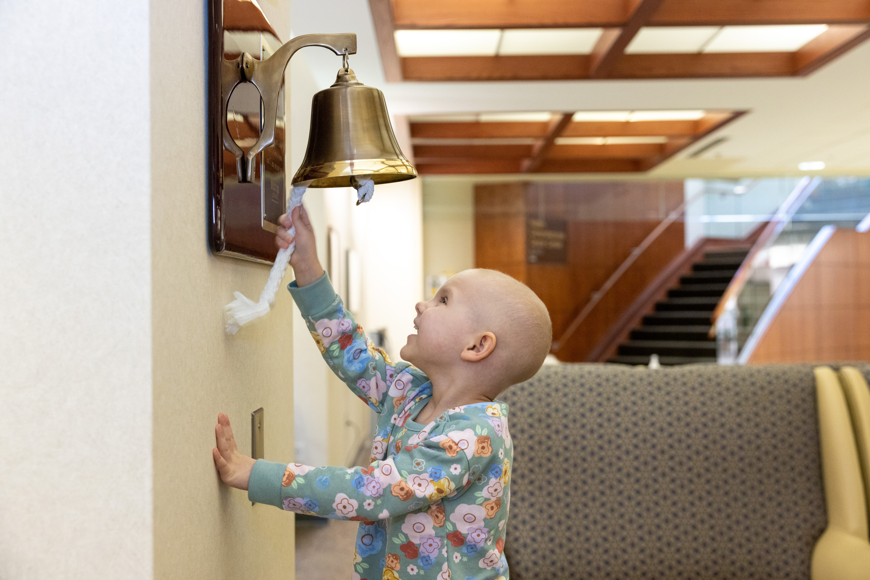 Ringing the bell at Holden Comprehensive Cancer Center. Simulated pediatric radiation oncology appointment on Tuesday, March 28, 2023. Patient and parent consent on file.