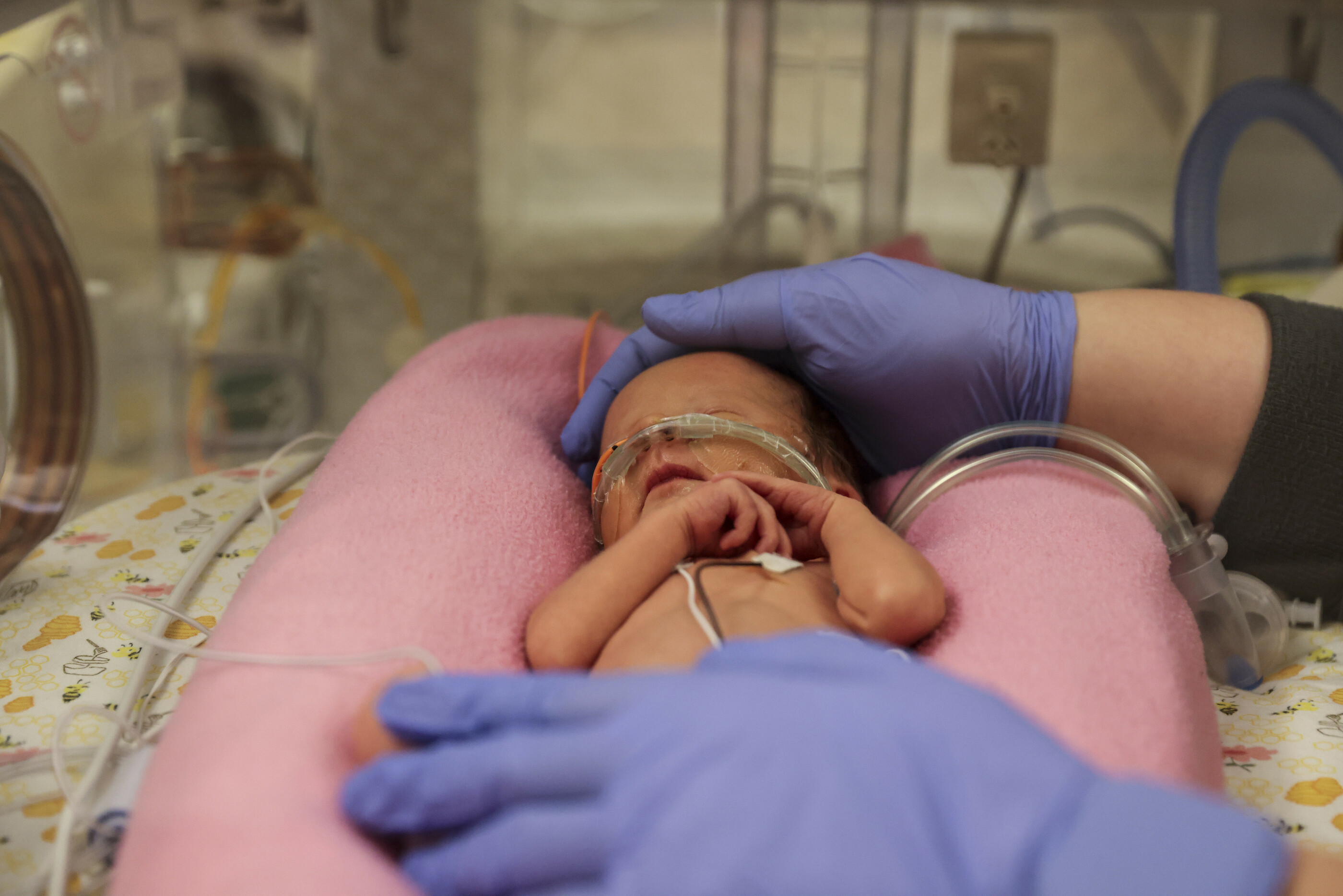 Alyssa Wessel, RN-BSN student, and Kayla Fobian, RN, BSN, record vital signs in premature twins in the Neonatal Intensive Care Unit at the University of Iowa Hospitals and Clinics in Iowa City on Thursday, Sept. 29, 2022. (Photo by Rebecca F. Miller/College of Nursing)