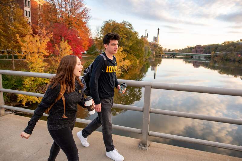 Students walking across a bridge