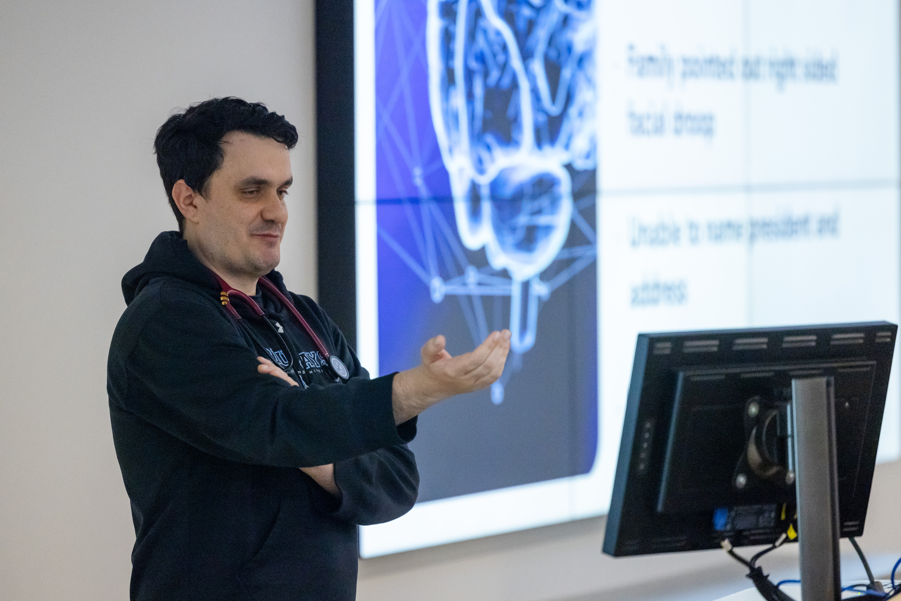 A pediatric resident leads a lecture.