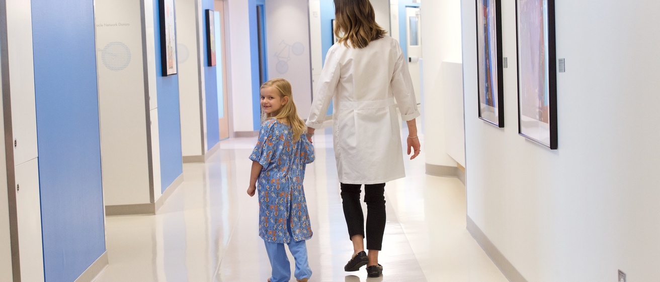 Child with provider in hall