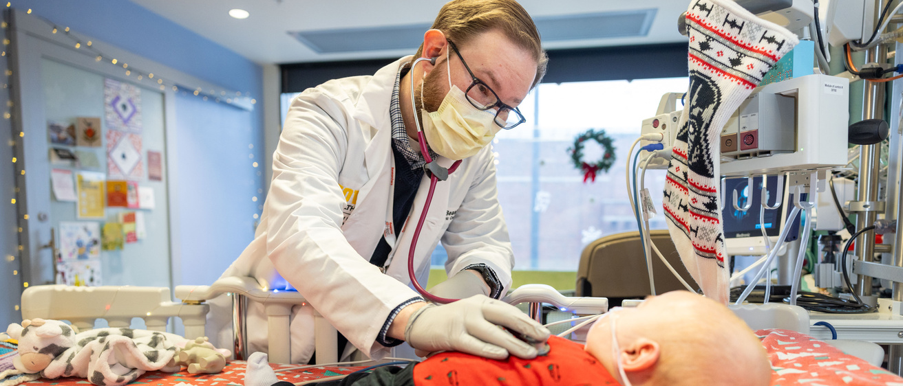 Wesley Peterson, shown with cardiologist Gary Beasley, received a heart transplant before Christmas and is recovering in the UI Health Care Stead Family Children’s Hospital Pediatric ICU on Friday, Dec. 27, 2024.
