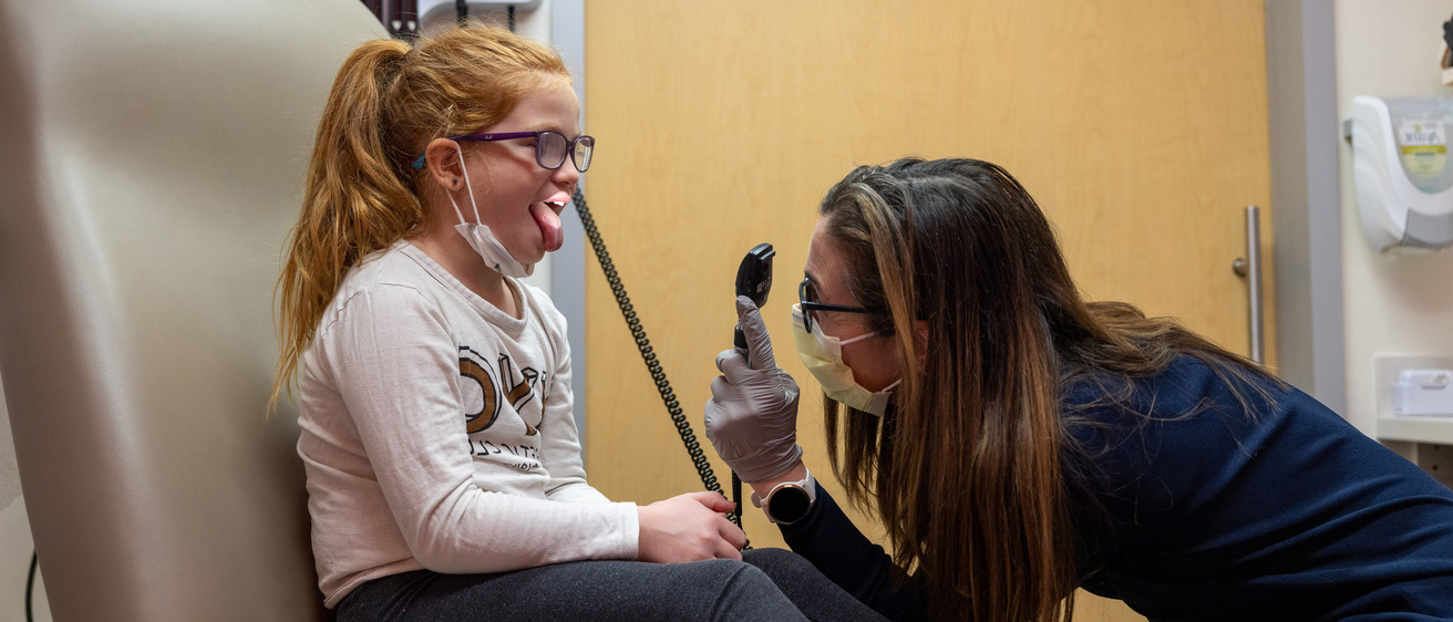 Dr. Cat Pinnaro, Pediatric Endocrinologist, with a Turner syndrome patient in the Pediatric Specialty Clinic on Wednesday, Dec. 7, 2022. Patient consents on file.