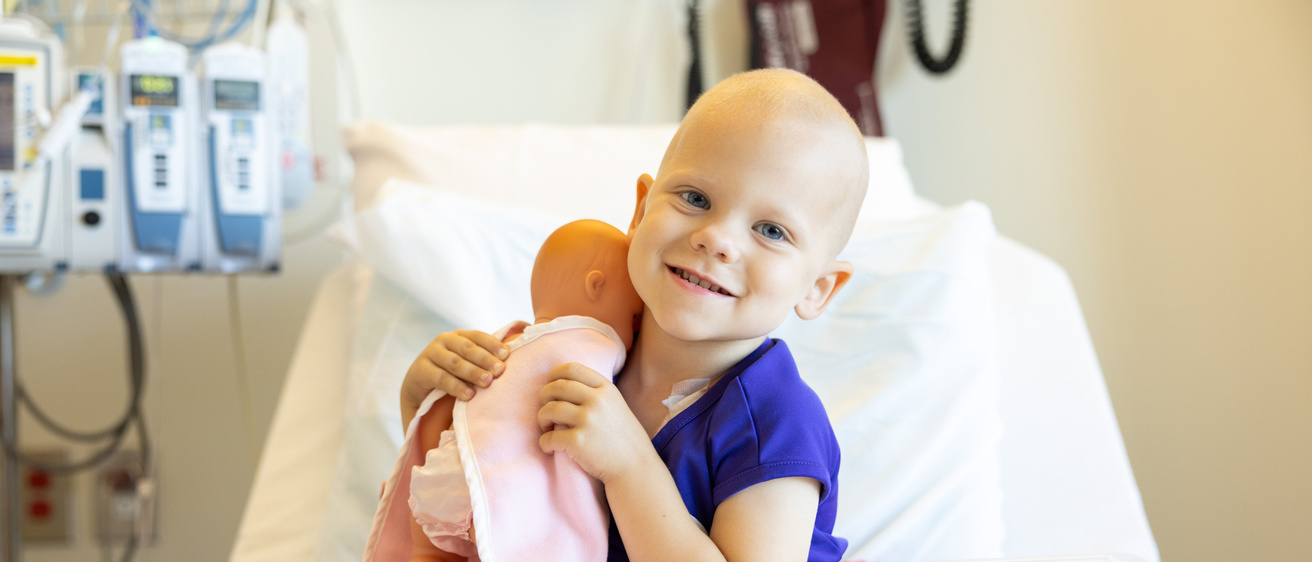 Pediatric oncology patients and care team at University of Iowa Stead Family Children’s Hospital on Tuesday, Aug. 15, 2023. Consent forms on file. Dr. Sara Claire Horton with patient in infusion room