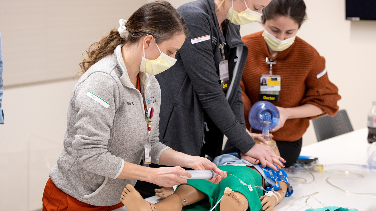 Pediatrics residents practice simulated patient care during an academic half day training. 