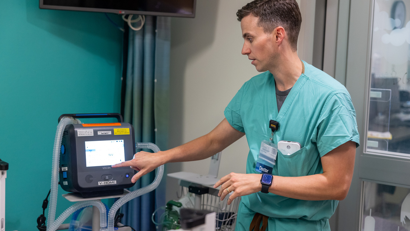 Dr. Daniel Hinds, pediatric pulmonologist, prepares a NICU simulation for parents.